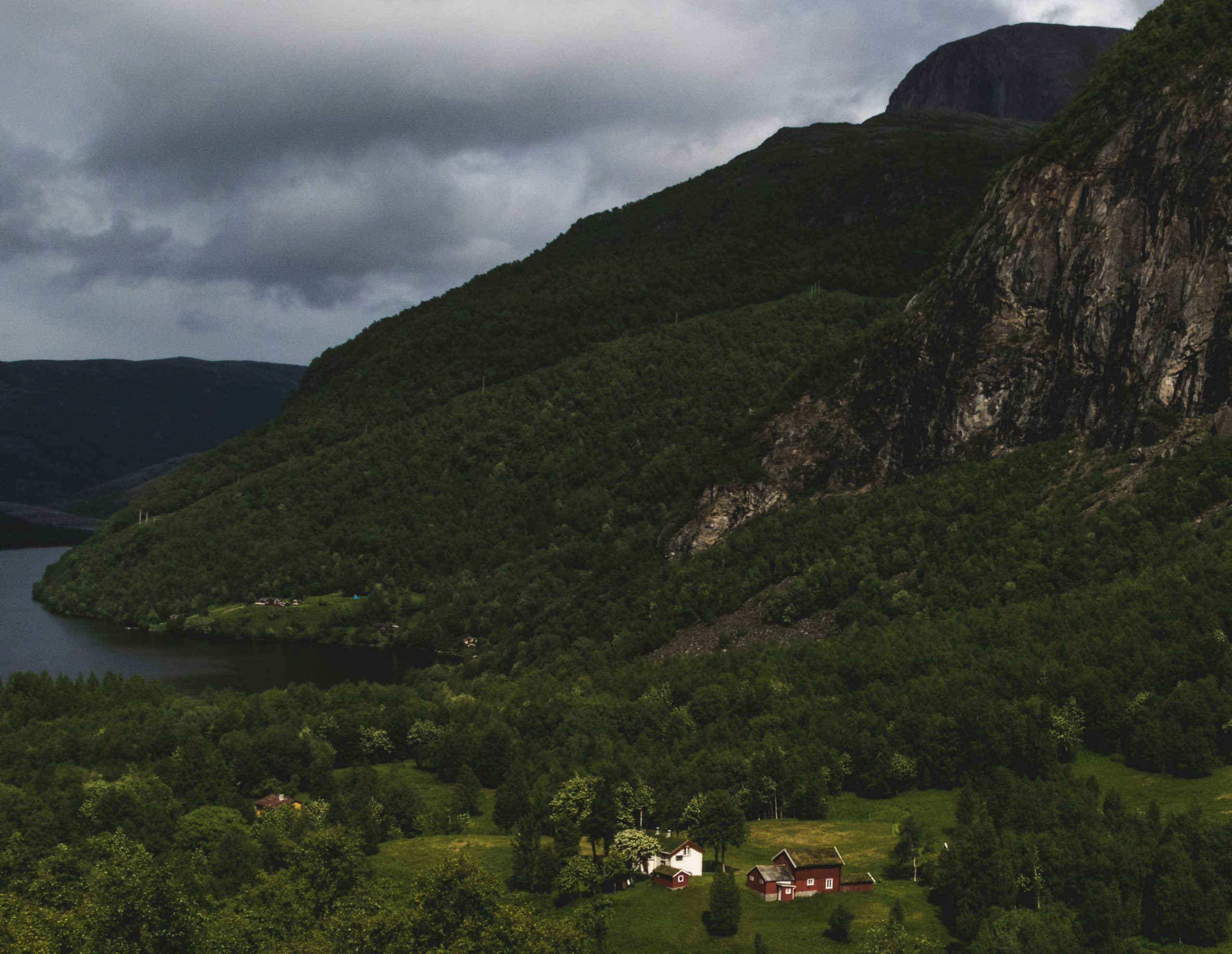 explore the breathtaking beauty of norway's fjords, nestled between majestic mountains and crystal-clear waters.